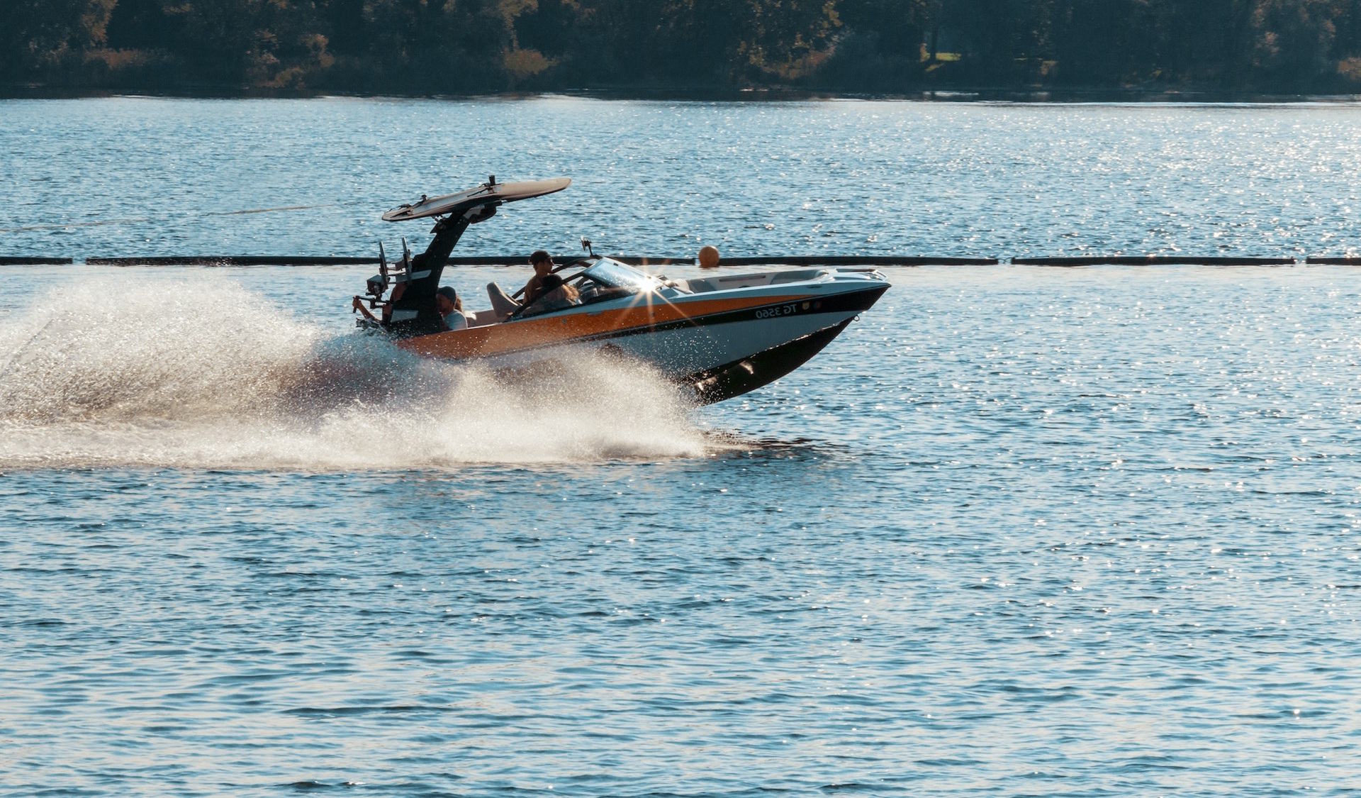 Couple sitting together on couch looking at laptop